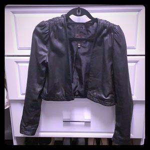 Cropped light leather jacket.